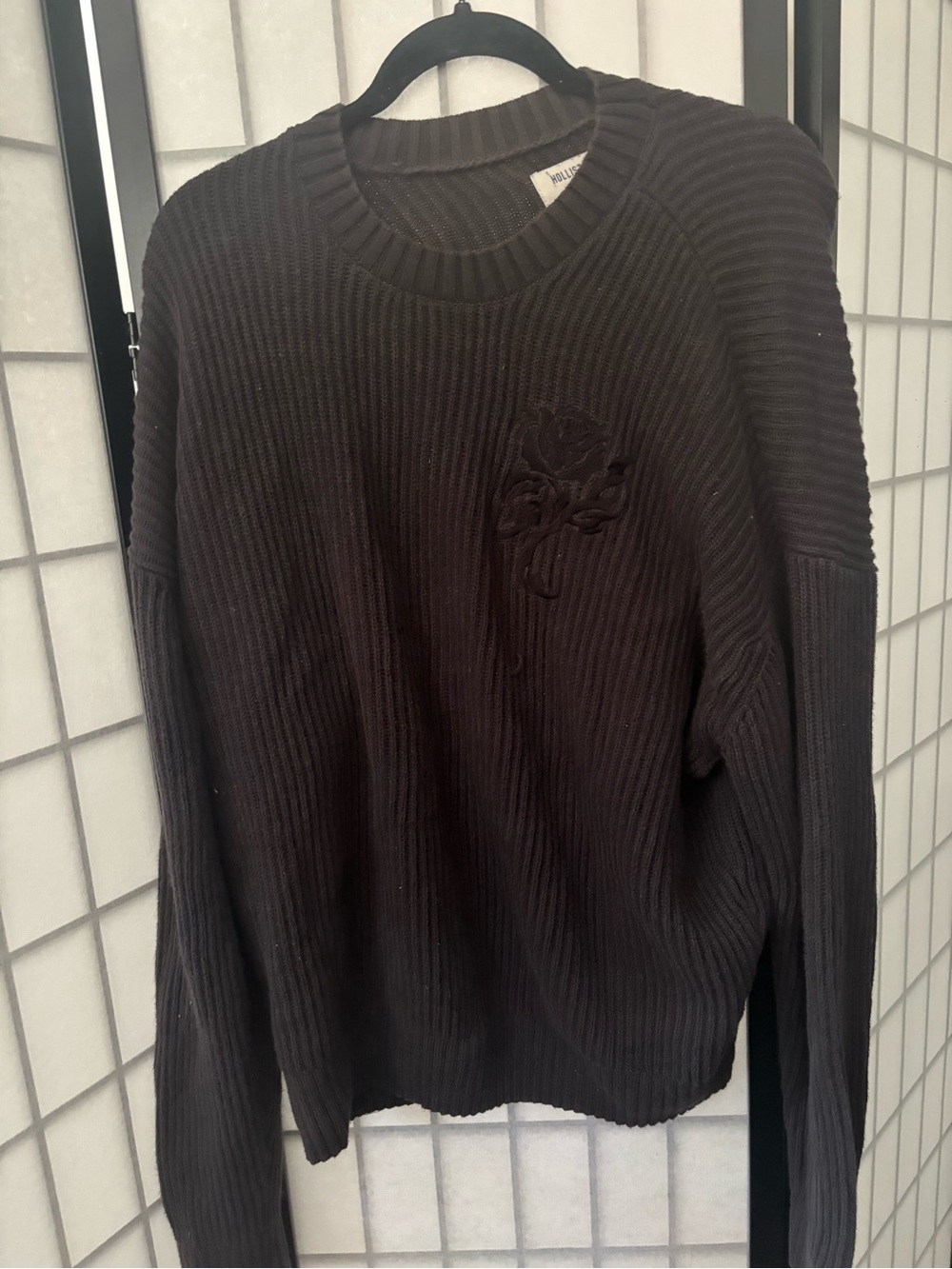 Mens black boxy fit Hollister knit sweater with rose embroidery.